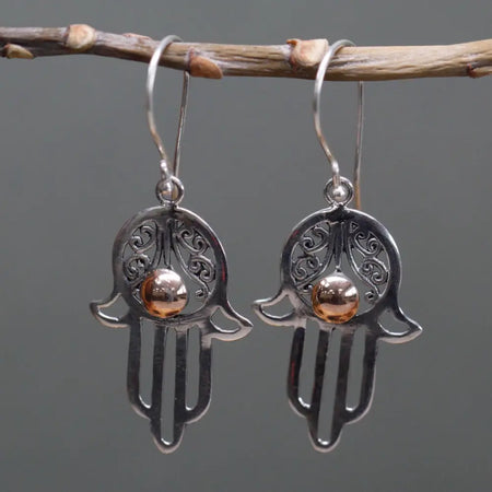 Sterling silver hamsa earrings with intricate filigree and a central 18ct yellow gold bead detail