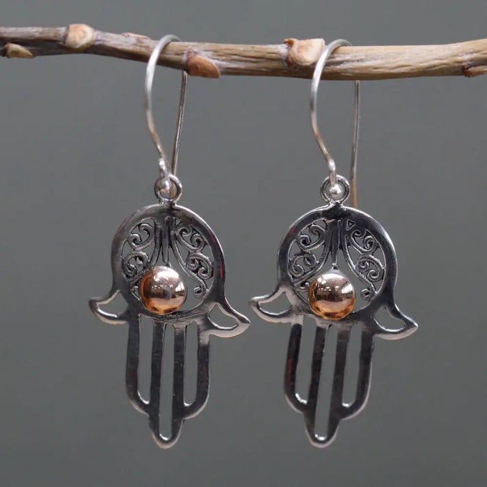 Sterling silver hamsa earrings with intricate filigree and a central 18ct yellow gold bead detail