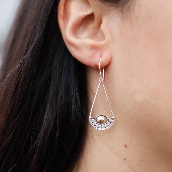 Silver teardrop earring with 18ct yellow gold bead and small silver dots along the lower edge from luna balance