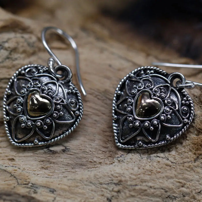 Sterling silver heart-shaped earrings with intricate filigree and a central 18ct yellow gold heart accent