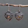 Sterling silver heart-shaped earrings with intricate filigree and a central 18ct yellow gold heart accent