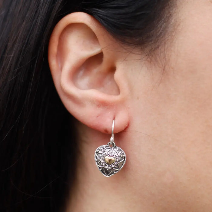 Silver heart-shaped sterling silver earring with intricate filigree and central 18ct yellow gold accent
