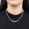 Sterling silver chain necklace with an 18ct yellow gold tribal pattern pendant featuring intricate swirling designs