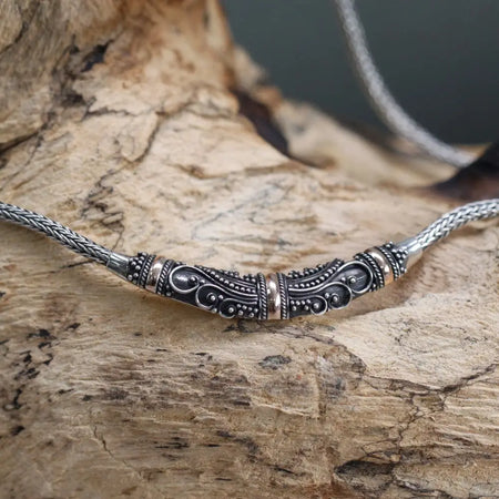 Sterling silver and 18ct yellow gold necklace with tribal pattern and beaded details on a braided chain