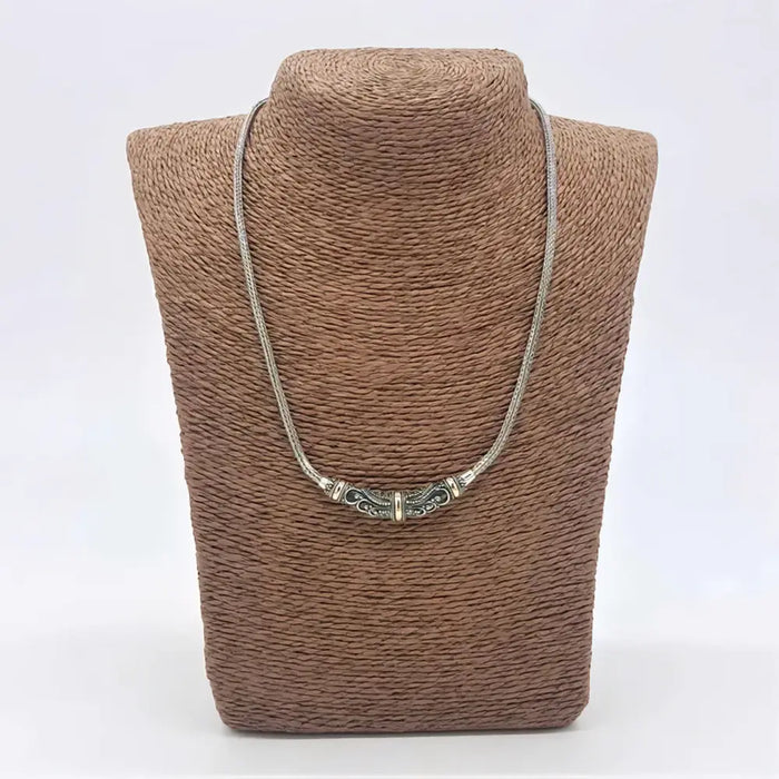 Sterling silver necklace with 18ct yellow gold tribal pattern and delicate filigree segmented centerpiece
