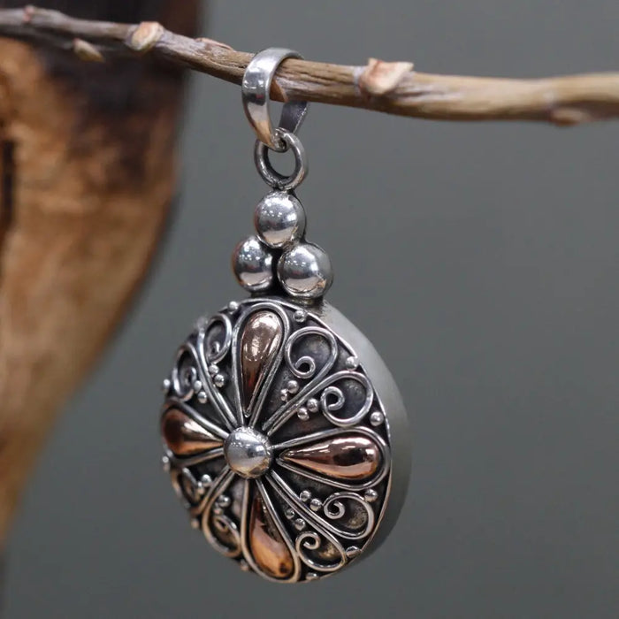 Sterling silver and 18ct yellow gold classic round drop pendant with copper-toned filigree and floral design beads