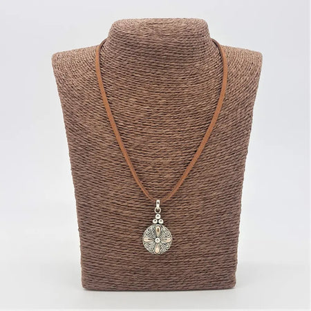 Sterling silver and 18ct yellow gold classic round drop pendant with silver floral design on brown leather cord