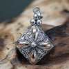 Sterling silver square drop pendant with 18ct yellow gold accents featuring filigree and floral motif details
