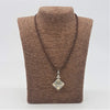 Silver filigree pendant necklace with a square drop charm in sterling silver and 18ct yellow gold on brown leather cord