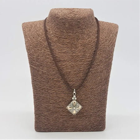 Silver filigree pendant necklace with a square drop charm in sterling silver and 18ct yellow gold on brown leather cord