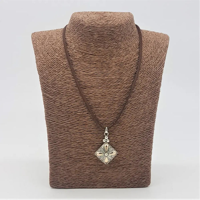 Silver filigree pendant necklace with a square drop charm in sterling silver and 18ct yellow gold on brown leather cord