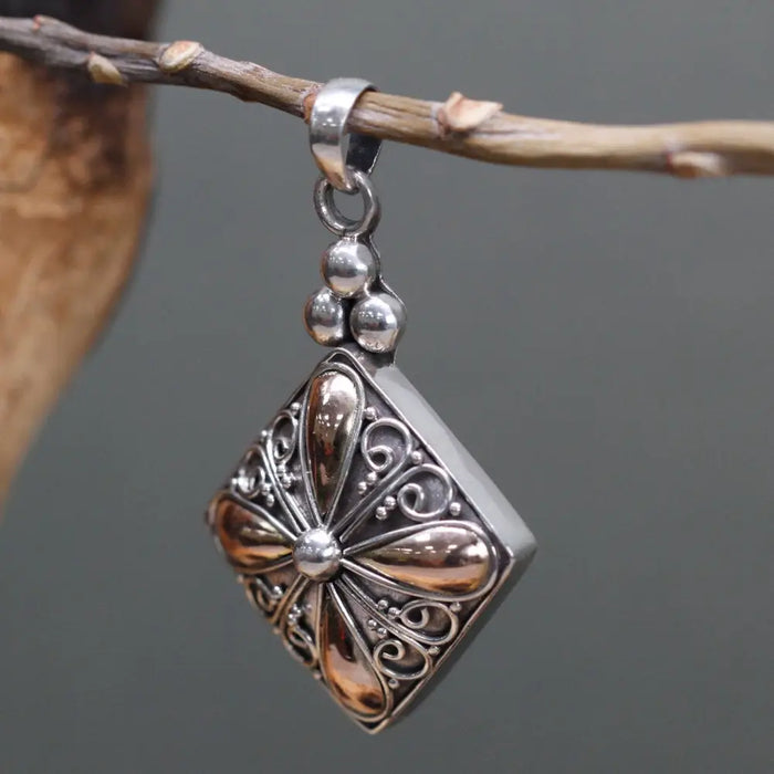 Sterling silver square drop pendant with intricate floral filigree and polished 18ct yellow gold copper accents and beads