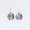 Sterling silver circular earrings with abalone shells and silver-toned filigree floral designs and hook clasps