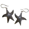 Sterling silver earrings shaped like starfish with a textured dotted surface and silver hook closures