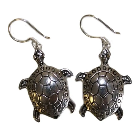 Sterling silver earrings shaped like turtles with detailed shell patterns and small circular silver embellishments on edges