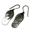 Sterling silver flip-flop earrings with mother-of-pearl finish and metallic straps shown on a white background
