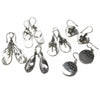 Sterling silver flip-flop earrings with mother-of-pearl surfaces featuring dragonflies turtles and swirling designs