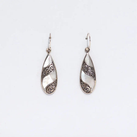 Sterling silver teardrop earrings with intricate swirling patterns and a white mother of pearl inlay