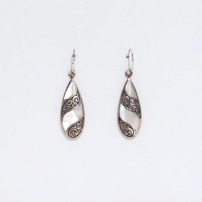 Sterling silver teardrop earrings with intricate swirling patterns and a white mother of pearl inlay