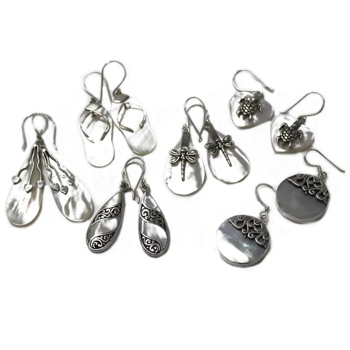 Sterling silver teardrop earrings with intricate dragonfly and turtle designs on mother of pearl surfaces