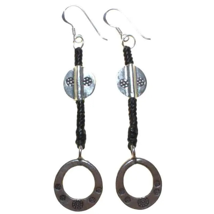 Silver dangle earrings with black waxed cord, sterling silver discs, and a vertical bar accent in textured pattern