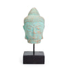Stillness buddha head statue with green copper finish and detailed dot patterns on albasia wood stand