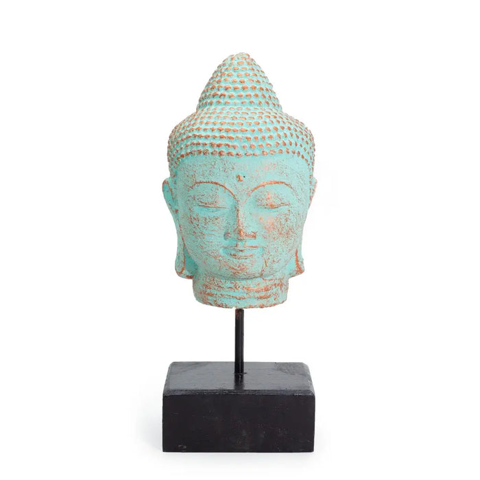 Stillness buddha head statue with green copper finish and detailed dot patterns on albasia wood stand