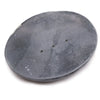 Dark gray classic oval soap dish made of soapstone with a textured surface and three small drainage holes