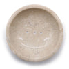 Beige honey marble soap dish with three circular drainage holes in a curved stone design