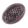 Oval dark brown soapstone soap dish with cross-cut holes pattern for draining and holding soap