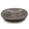 Dark gray stone soap dish with three small drainage holes made of grey marble in an oval shape
