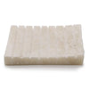 Cream-colored rectangular soap dish with ridged textured surface made of white onyx stone soap dish