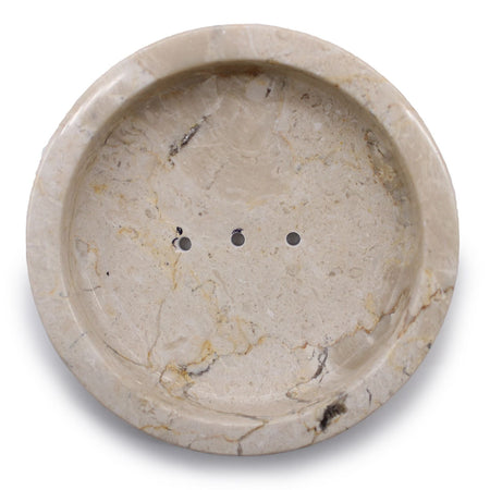Beige stone soap dish made of honey marble with subtle veining and three drainage holes for bathroom use