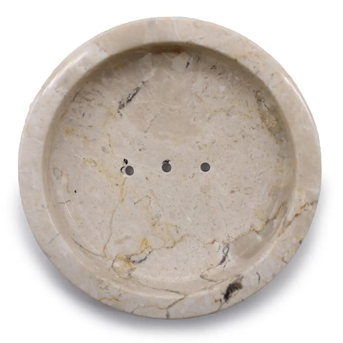 Beige stone soap dish made of honey marble with subtle veining and three drainage holes for bathroom use