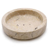 Round cream-colored honey marble soap dish with subtle veining and three drainage holes for bathroom use