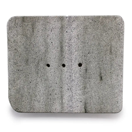 Gray speckled ziolit stone soap dish square shape with three evenly spaced circular holes for drainage
