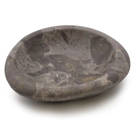 A smooth gray stone soap dish with an oval shape and subtle marbling made from natural stone material