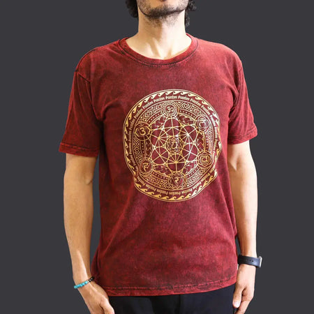 A maroon stonewashed cotton t-shirt with a detailed gold geometric mandala design centered on the chest