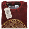 A maroon stonewashed cotton t-shirt with a gold and dark brown freedom mandala design in xl size