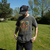 Charcoal stonewashed cotton t-shirt with a faded compass of life design in gold teal and maroon large size