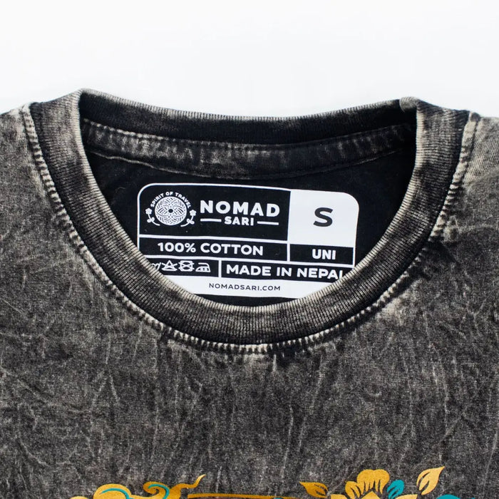 Black stonewashed cotton t-shirt with faded texture and colorful floral embroidery at the bottom in charcoal small size