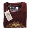 Maroon stonewashed cotton men’s t-shirt with gold ornate embroidery at the bottom in small size