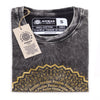 Stonewashed cotton t-shirt in dark grey with a distressed look and gold mandala design featuring freedom text along bottom edge