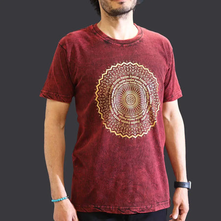 A maroon stonewashed cotton t-shirt with short sleeves and a faded texture featuring a gold mandala design