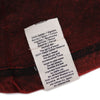 White woven fabric care label on maroon stonewashed cotton mandala t-shirt in size xl showing texture and material details
