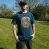 Dark teal stonewashed cotton t-shirt with stay wild moon child design of moons and geometric patterns in gold red and blue