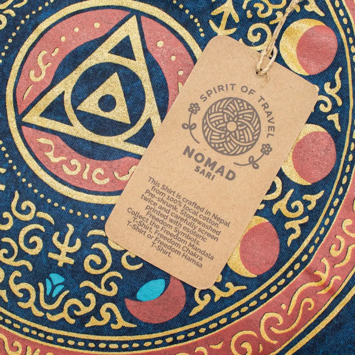 A stonewashed cotton t-shirt in blue with red patterns and gold embroidery featuring a mandala design stay wild moon