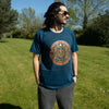A navy blue stonewashed cotton t-shirt with a circular moon phase design in gold red and brown stay wild moon style