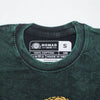 Dark green stonewashed cotton t-shirt with black nomad sari label showing brand name and small size indicator