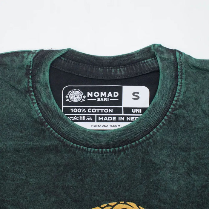 Dark green stonewashed cotton t-shirt with black nomad sari label showing brand name and small size indicator